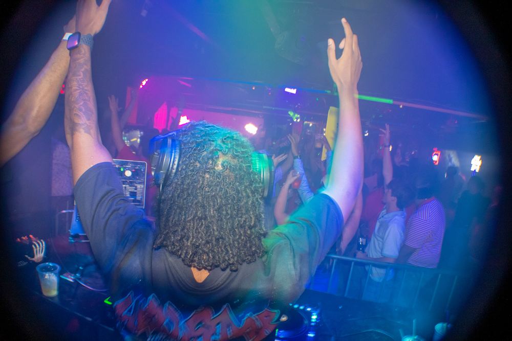 Crowd with hands up during a DJ Reese open format set