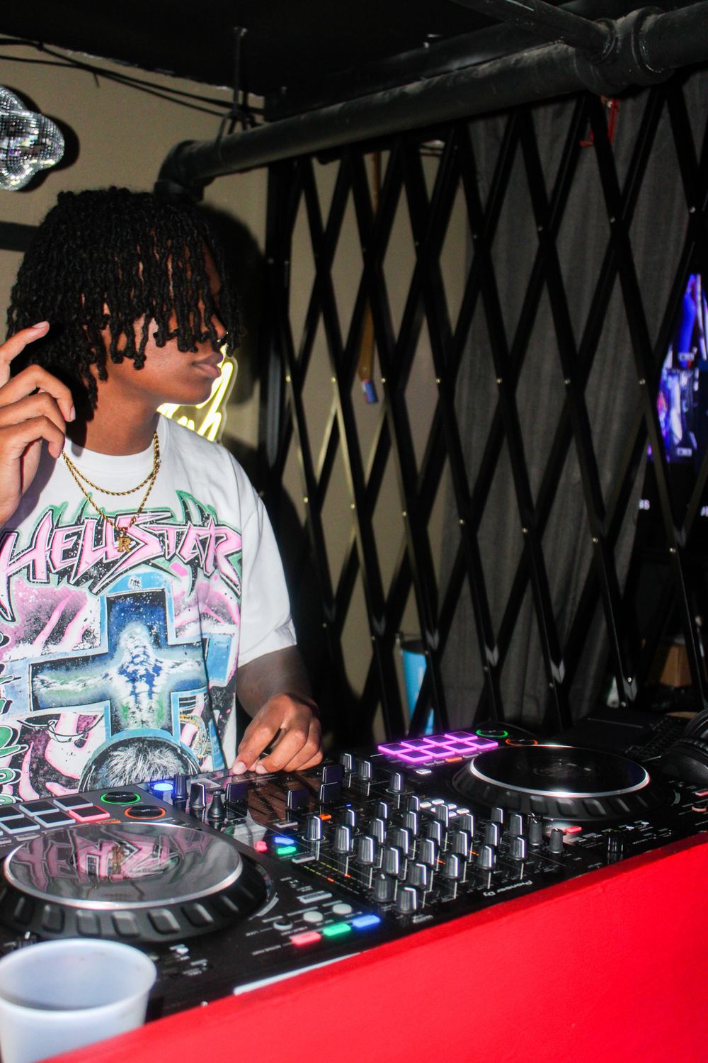 DJ Reese mixing on Pioneer CDJs during a live set